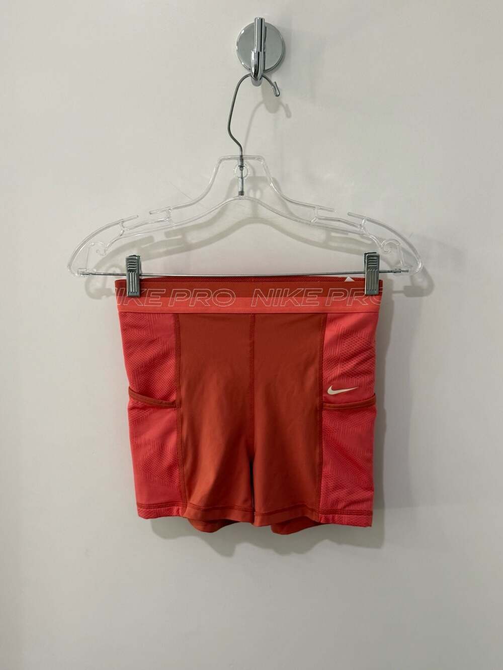 Nike Pro Women's High-Waisted 3" Training Shorts with Side Pockets in Coral Red